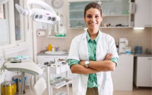 female dentist with arms crossed